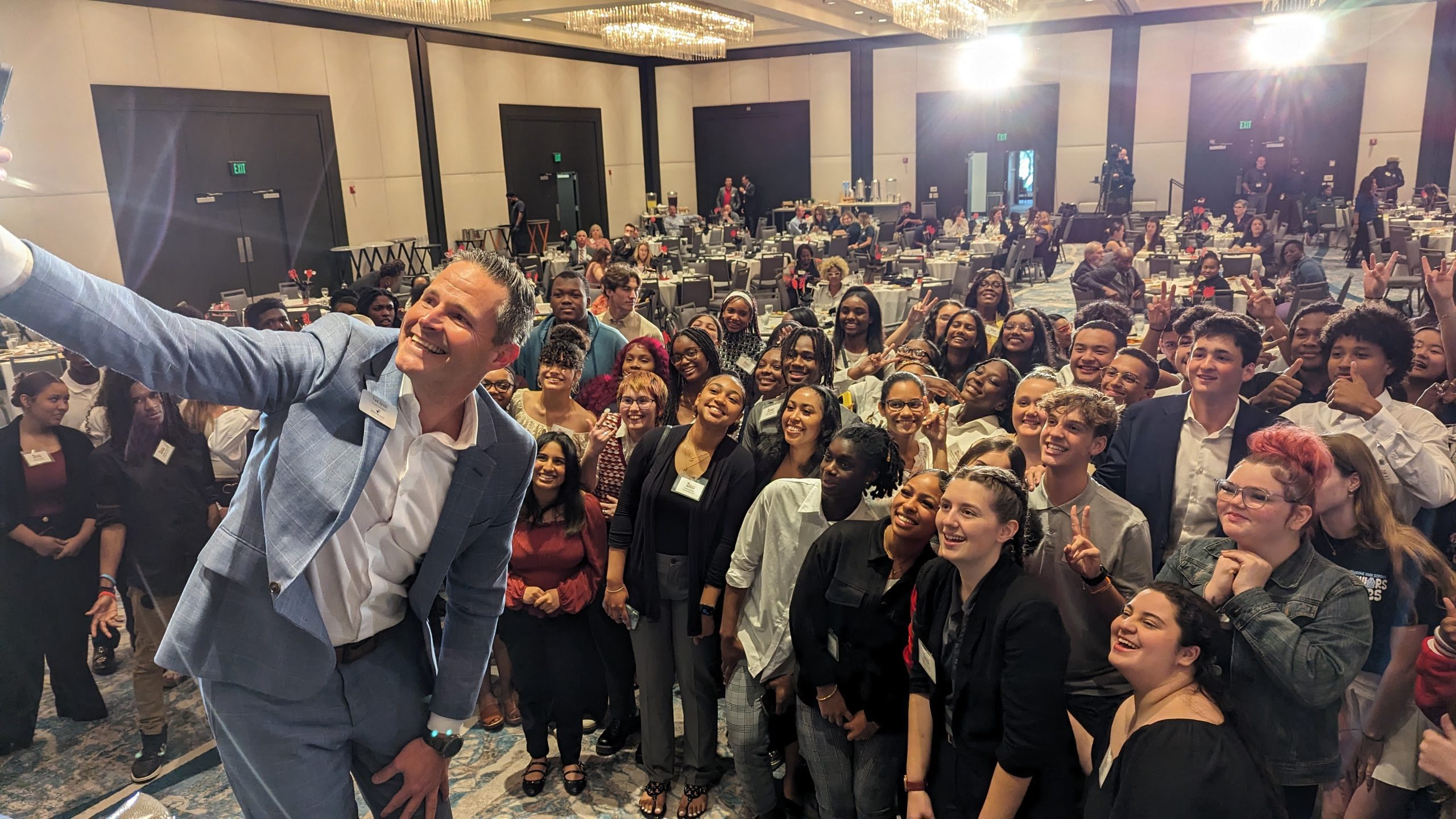 photo of Superintendent Ayers taking a selfie with students at GradNation 2024