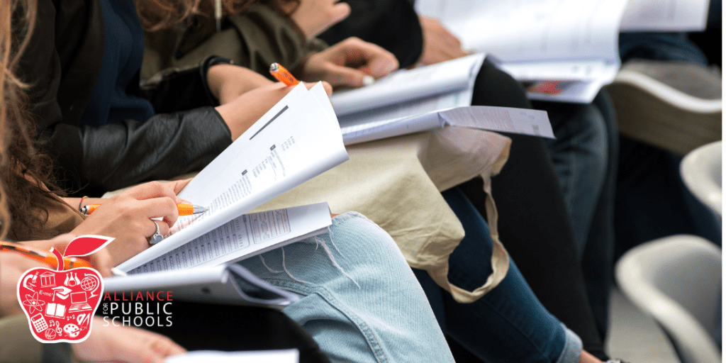 photo of students working on papers