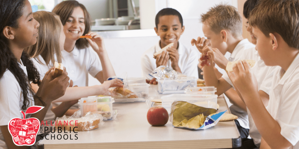 children eating lunch in a school cafeteria