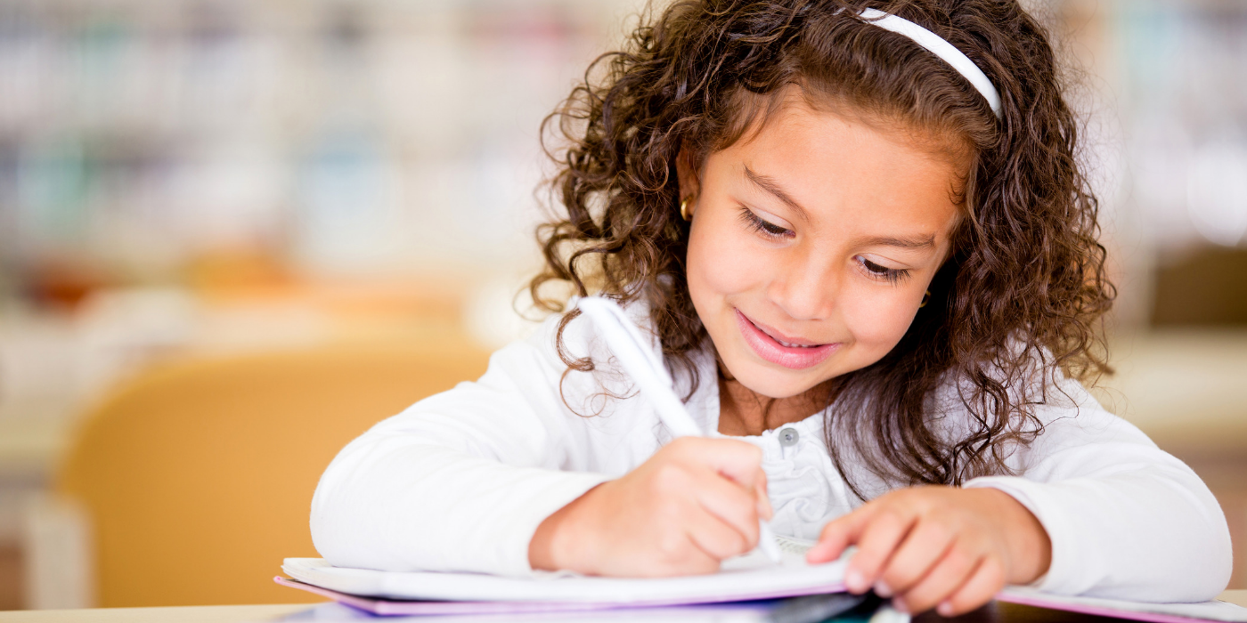 girl writing in a notebook