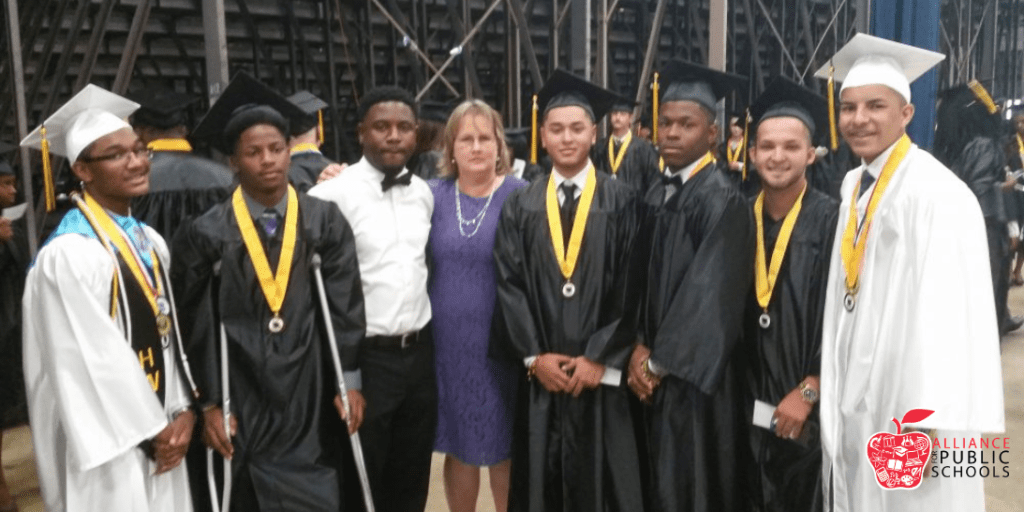photo of melissa erickson with students at graduation